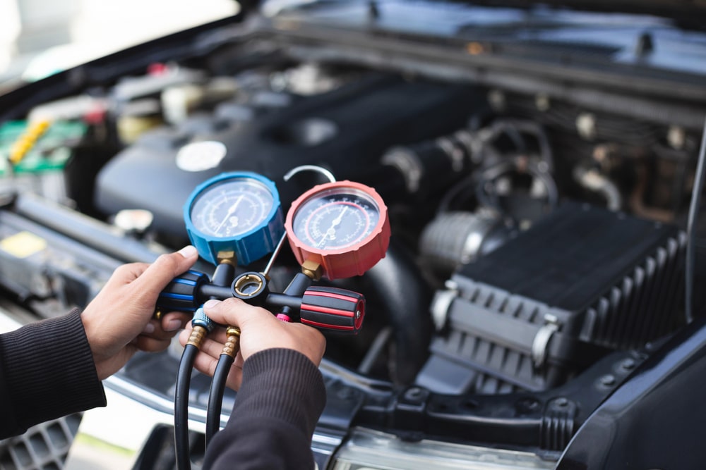 Car air conditioner check service leak test and fill refrigerant.