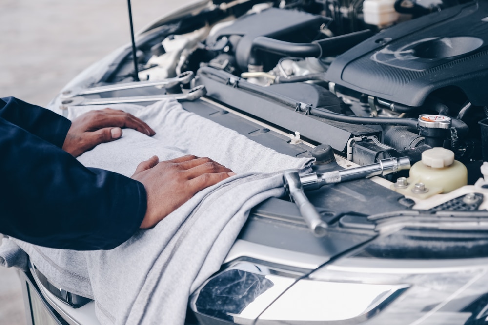 A technician checks collect detailed information during work.