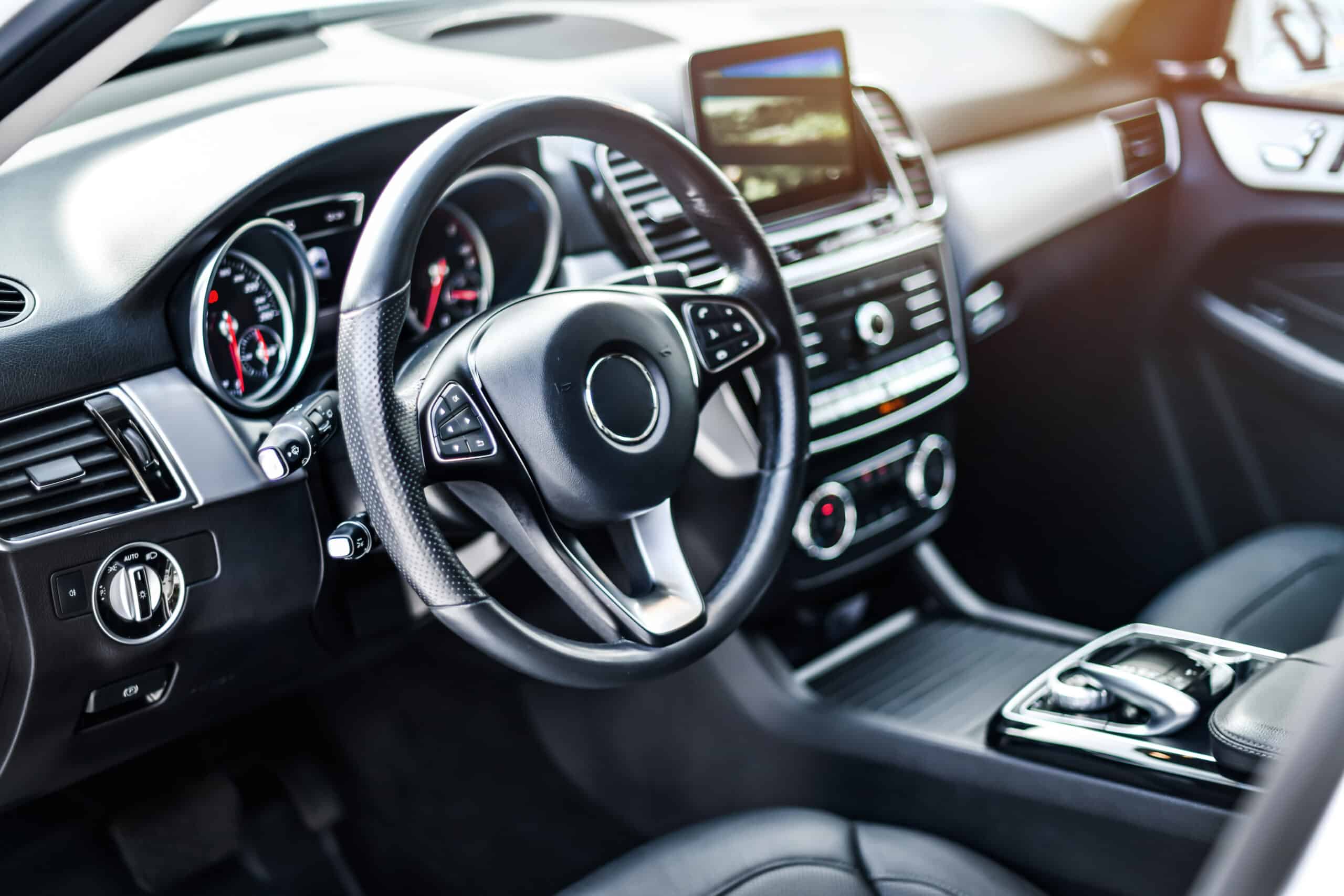 Steering wheel, instrument panel, and center console inside a vehicle